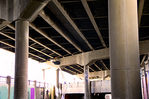 Photo of local urban artists painting murals under the I-70 viaduct during the 'duct-work Event (September 30, 2016).